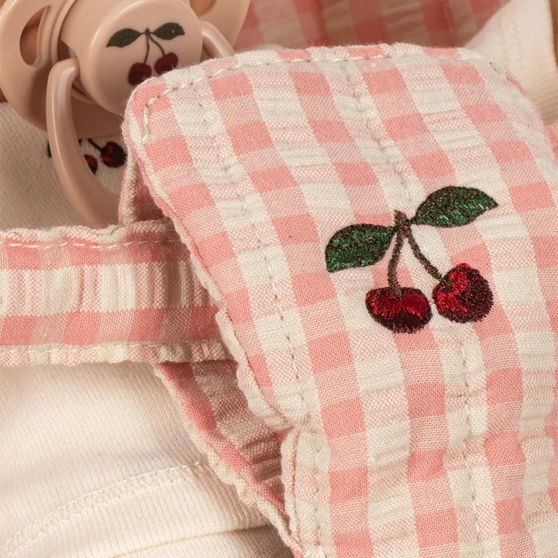 Poppy Puppe mit Puppenbuggy in Pink Check