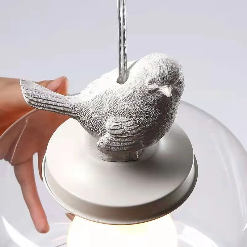 Aviella Bird Pendant Light From Euroselle With Warm Glow