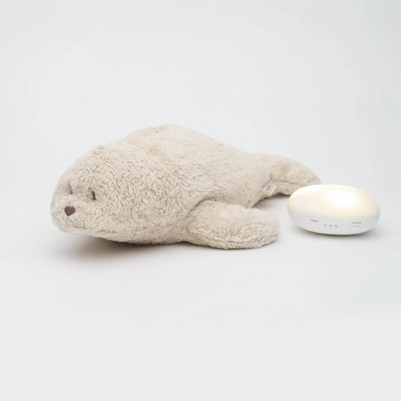 Organic Humming Robbe mit Lampe in Sand